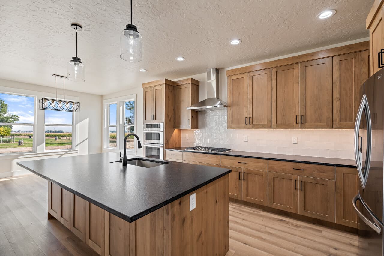 Kitchen with island in a TKO-built home